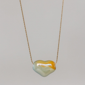 "Coeur naturel" Collier avec un coeur traversant en céramique